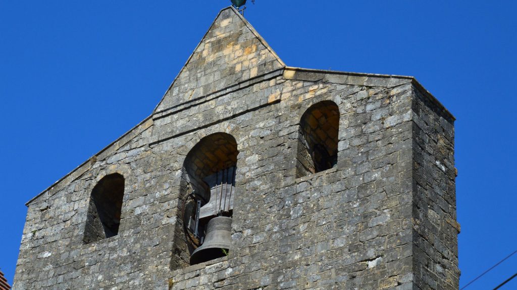Clocher roman en pierre, typique des eglises paroissiales dediees a saint Brice